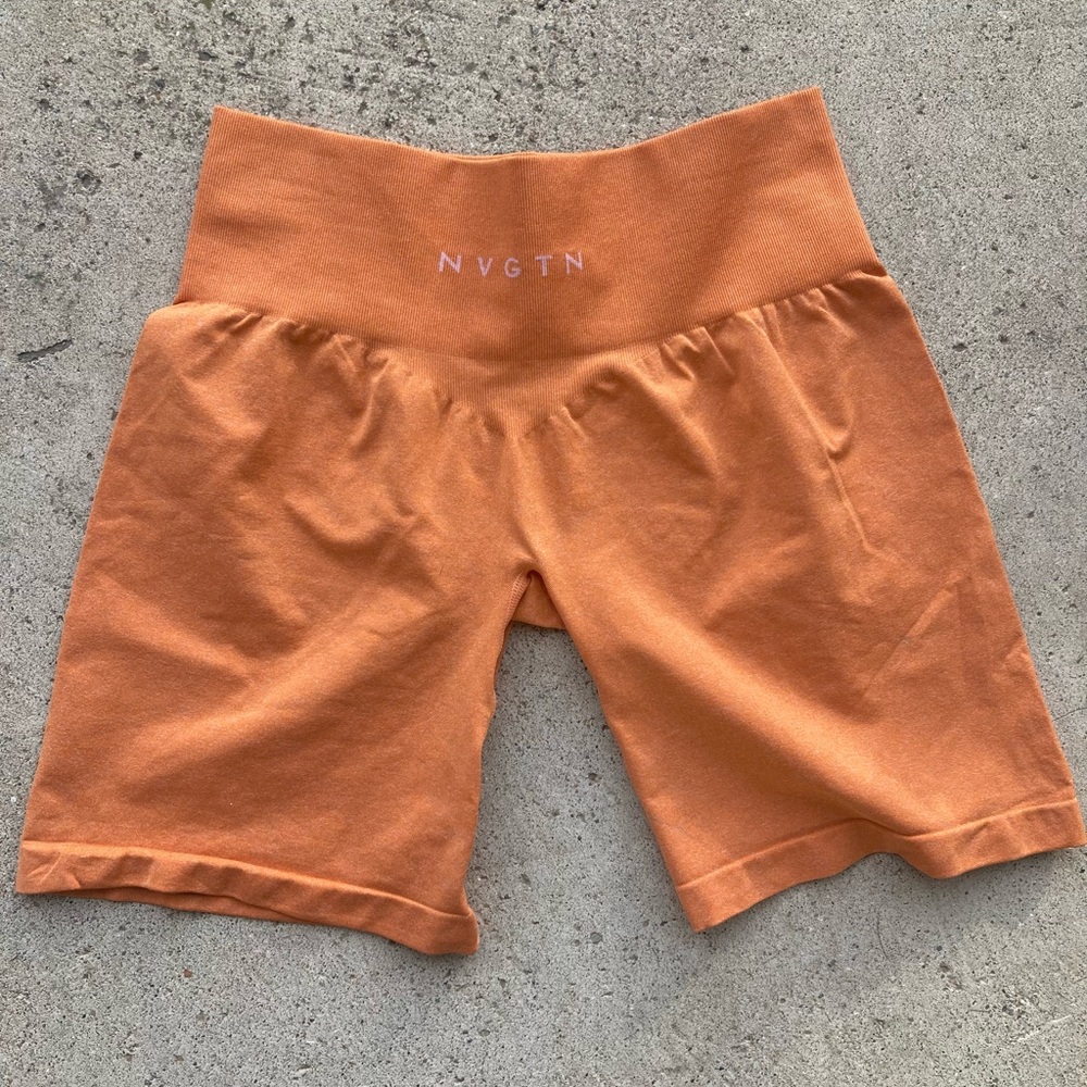 Orange NVGTN bike shorts